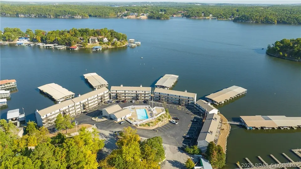 Aerial photograph of the condo buildings, covered docks, and surrounding lake