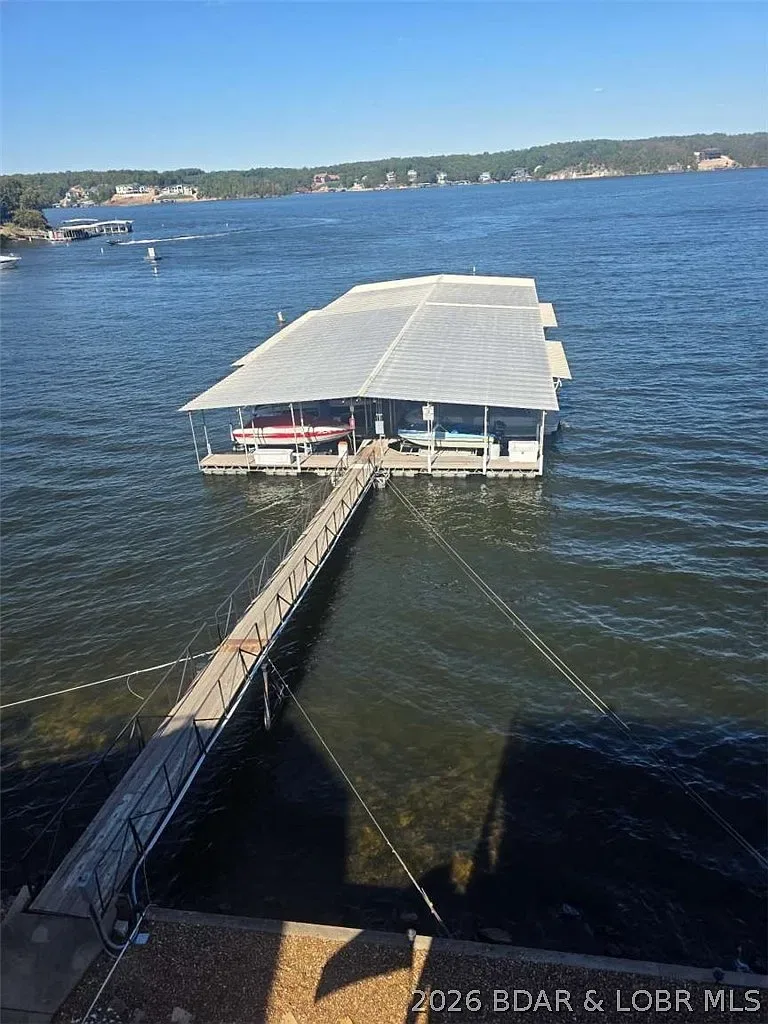 Walkway leading to covered boat slips on the lake